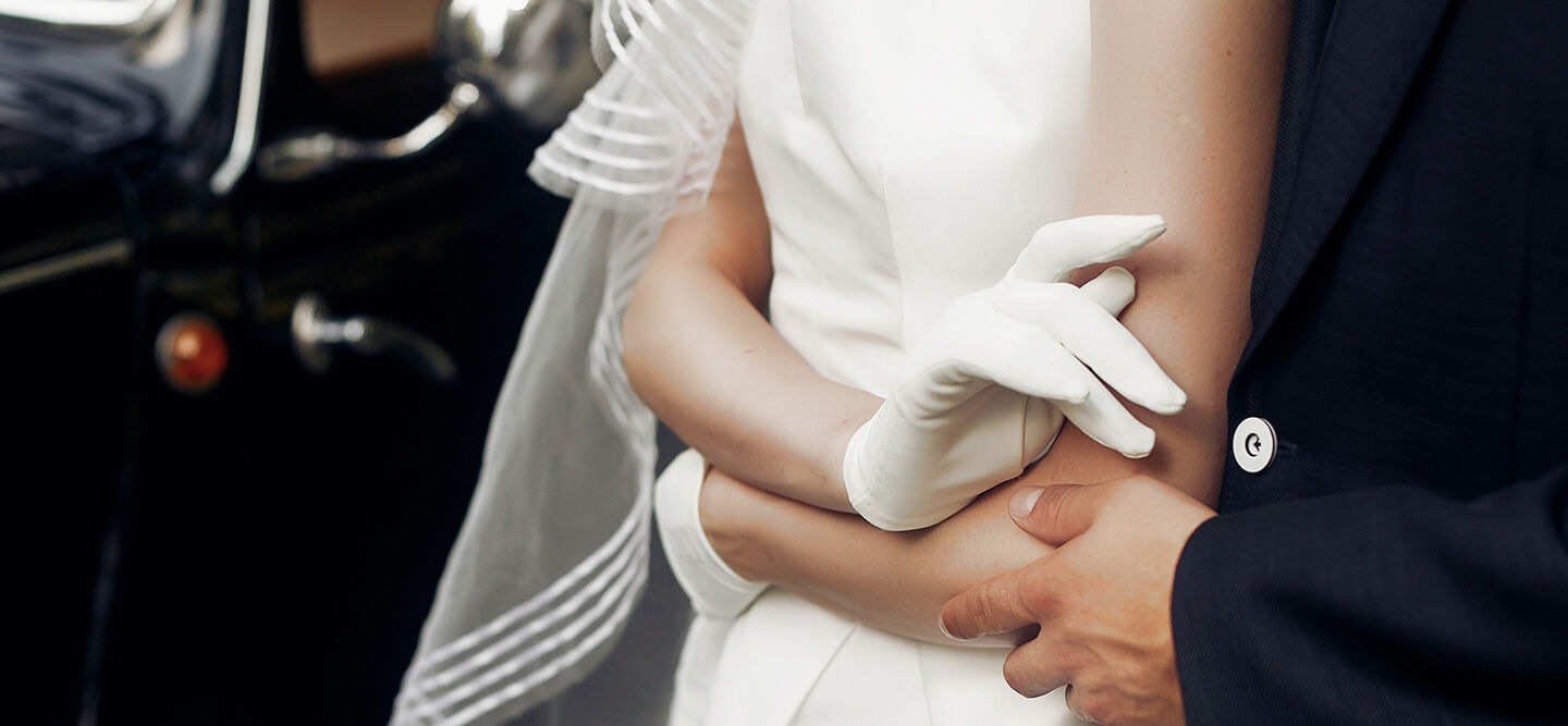 A couple embracing on their wedding day.